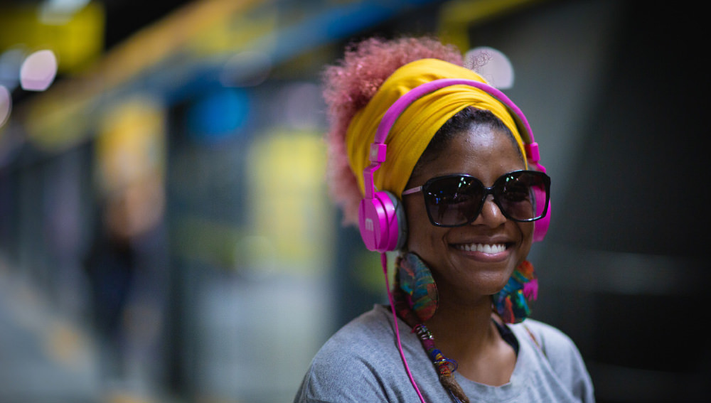 Woman listening to Broadstance Media production wearing headphones